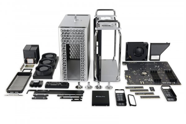 The individual components of a 2019 Mac Pro computer laid out on a table.