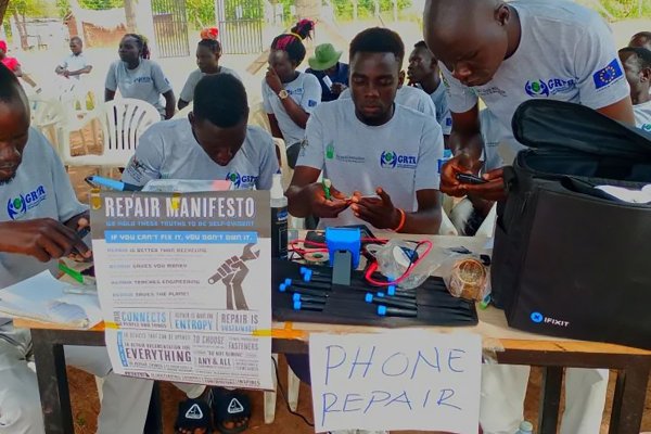 Students repair smartphones at the Rhino Refugee Camp in Uganda